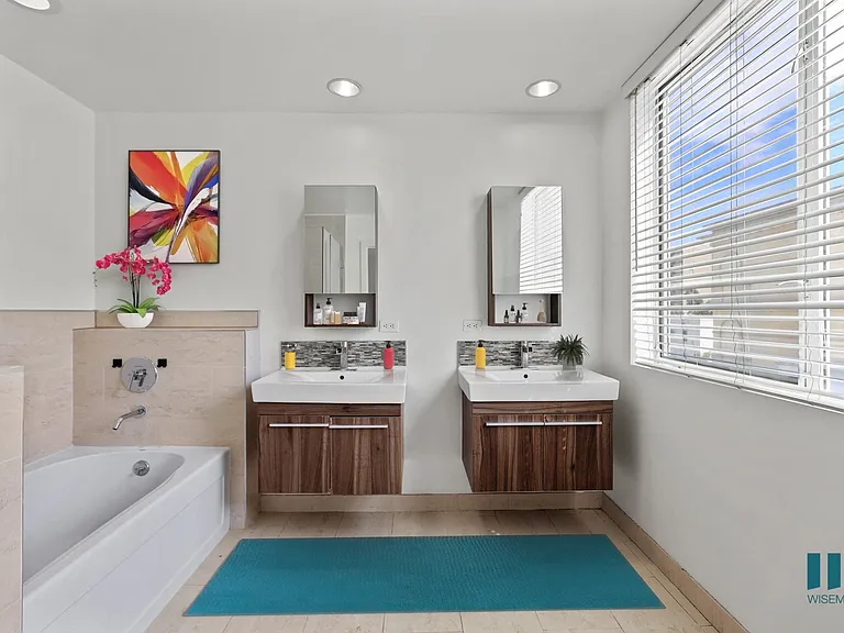 Bathroom with Bathtub, Walk-In Shower, and Double-Sink Vanity