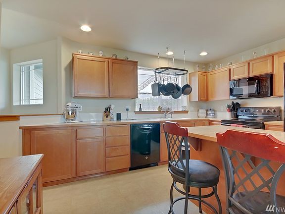 Kitchen with eat-in Bar and view of Mt. Rainier from the window.