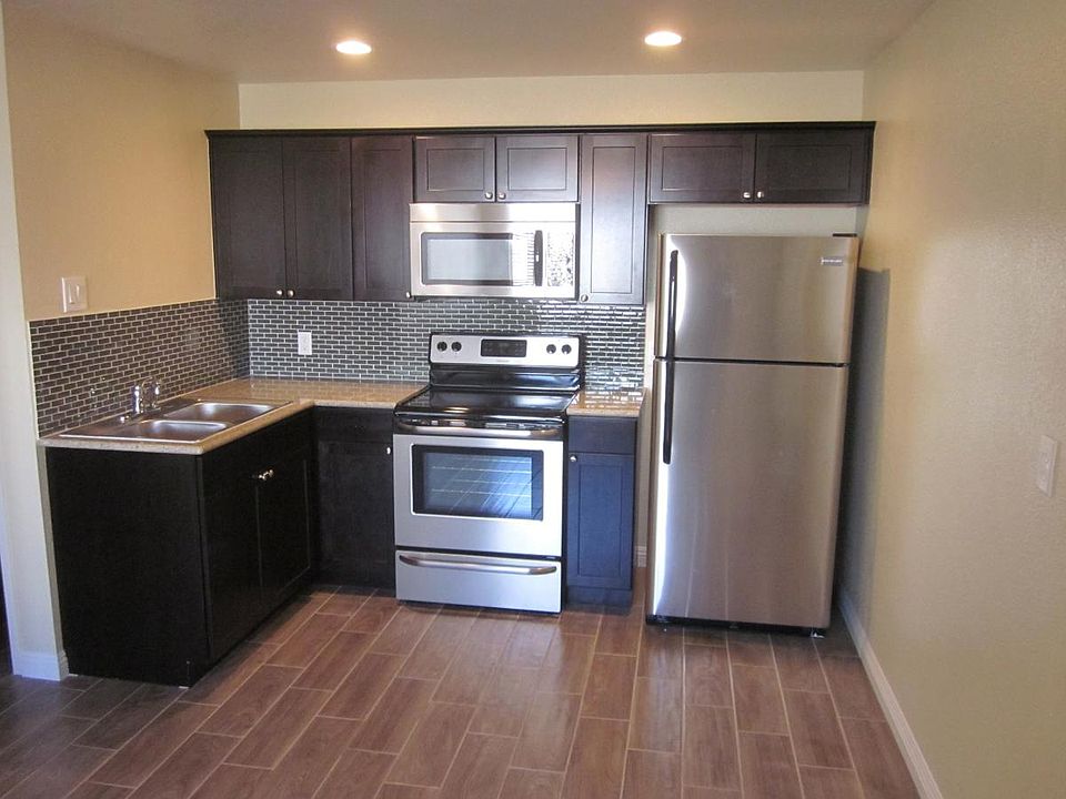 Brand New Upscale Kitchen with Stainless and Mosaic Tile Bac