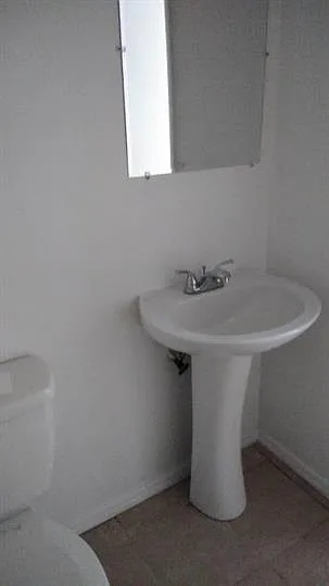 Bathroom View (Please note - all units have the same layout. Appliance colors may vary)
