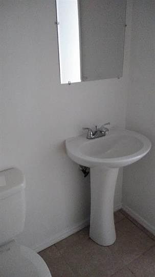 Bathroom View (Please note - all units have the same layout. Appliance colors may vary)