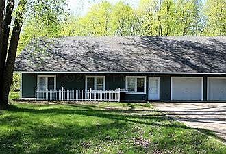 Large lot, shed to the right with lots of green space