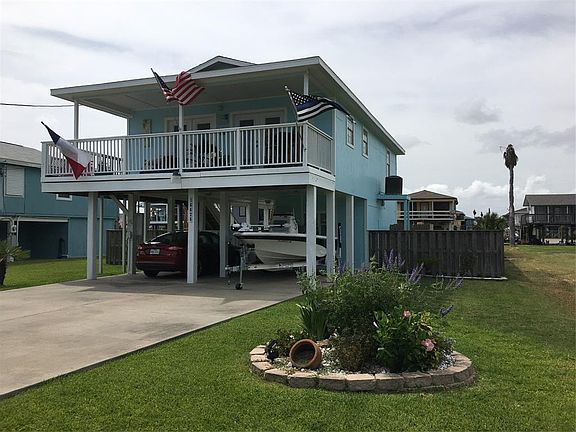 Front view of home...beautifully landscaped and completed fenced...