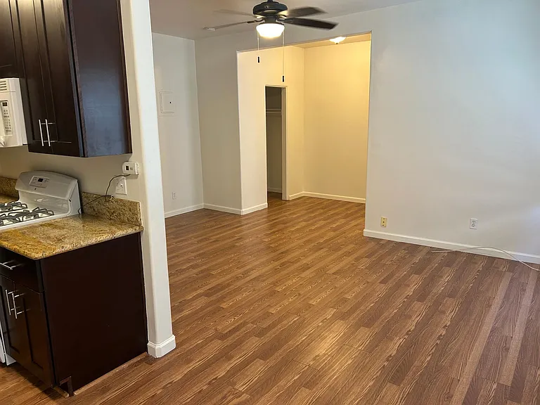 This studio has a enclave for a bedroom as shown on this picture.
