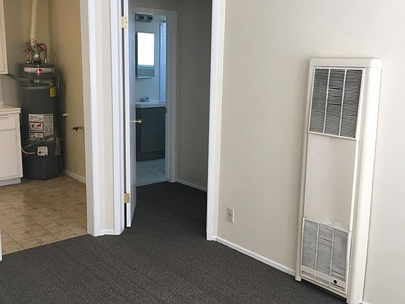 Living room angle to hallway, bathroom, bedroom