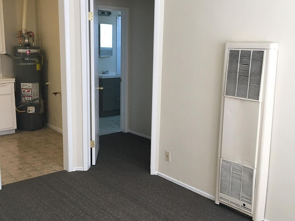 Living room angle to hallway, bathroom, bedroom