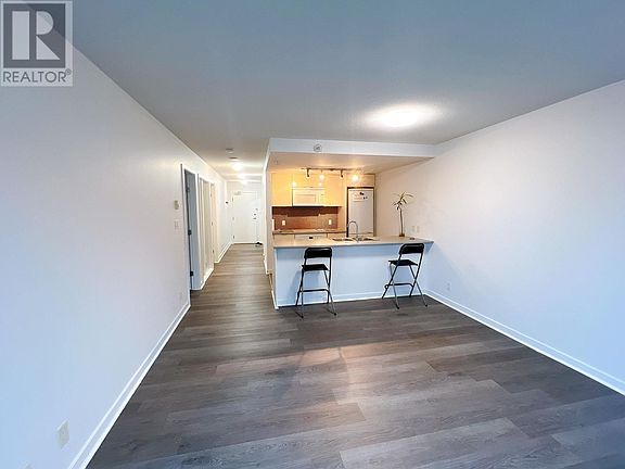 view from living room window to inside apartment