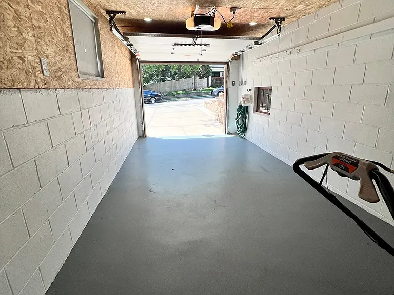 Extra deep single car garage with newer lighting and electric.