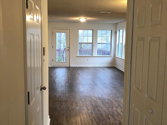 View of the tile entry way and family room as you enter the front door of the house.