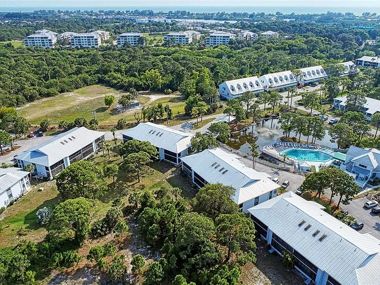Your sanctuary in the palms. __ A birds-eye look at the lush landscape surrounding our condos. Whether you're staying in Building 26 or one of our other units, you're always surrounded by nature's finest.