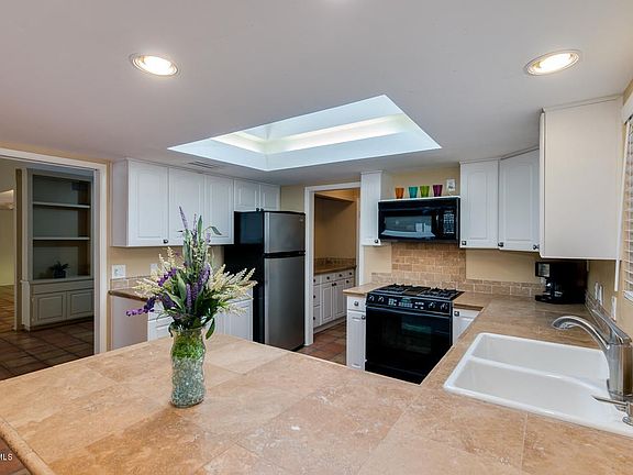 Kitchen with Travertine Tile Countertops
