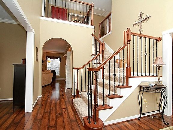 Foyer shows off the recent wide-plank laminate wood floors!