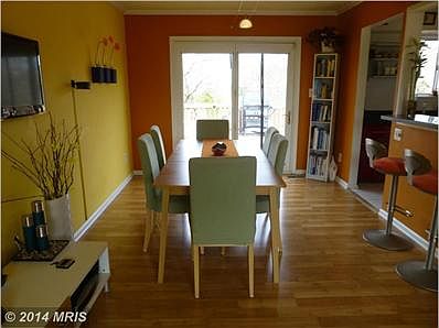 DINING RM WITH WOOD FLR & FRENCH DR TO CUSTOM DECK