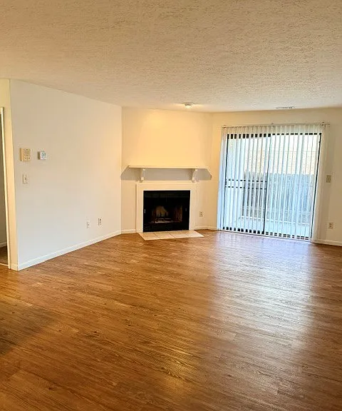 Living room with wood burning fireplace