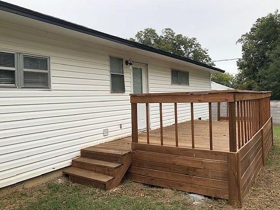New large elevated deck in backyard