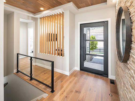 Beautiful covered entry that leads to an open foyer