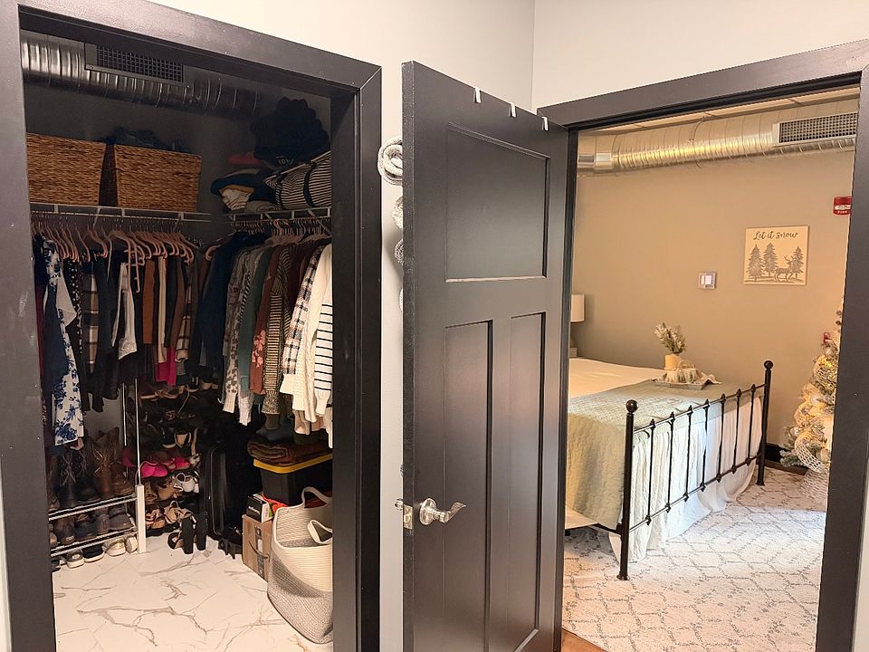 walk in closet and bedroom