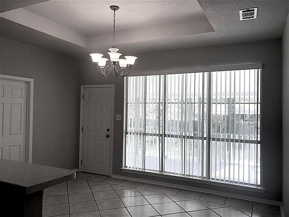 Dining area off the kitchen with access to the laundry room and back deck/yard.