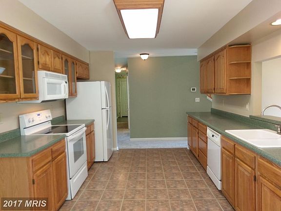 Kitchen offering ceramic tile flooring.