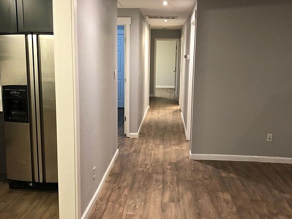 Living-room view of hallway looking at the Master bedroom in back of home
