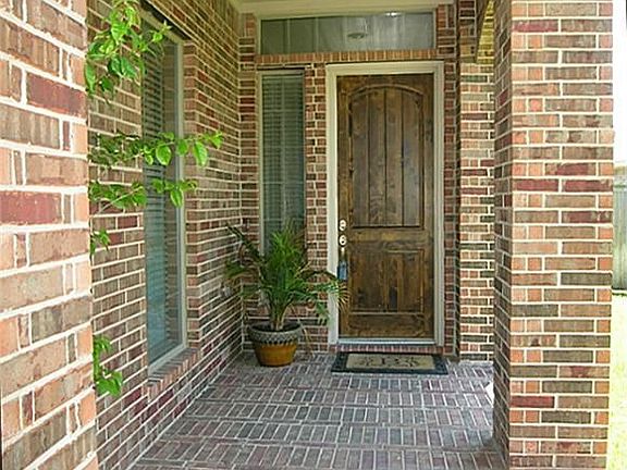 Covered Brick Porch, great for holiday decor and talking with neighbors!