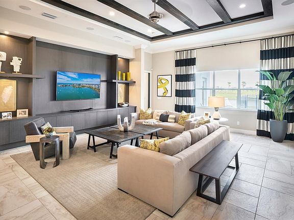 Great room offers an abundance of natural lighting with views of the lake