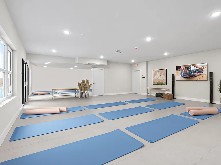 In addition to the fitness center, residents can enjoy the holistic benefits of a dedicated yoga room_promoting physical, mental, and spiritual well-being, all within the comfort of home.