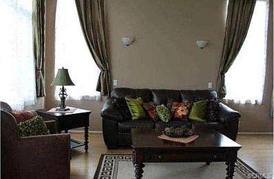 Living Room with vaulted ceilings and lots of streaming light th