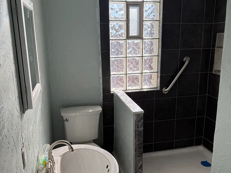 Bathroom before completion_glass wall now in place. New pics coming soon.