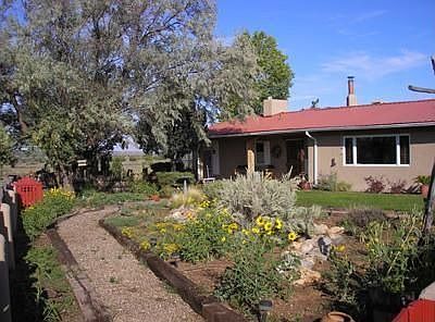 Front of home with view of garden