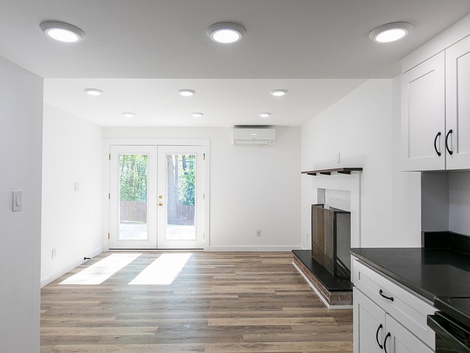 View of living room. French doors lead to backyard and private patio.