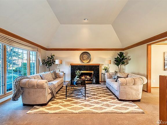Formal living room with gas fireplace. 