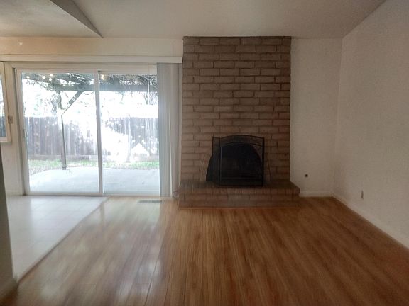 family room with fireplace, connected to breakfast area