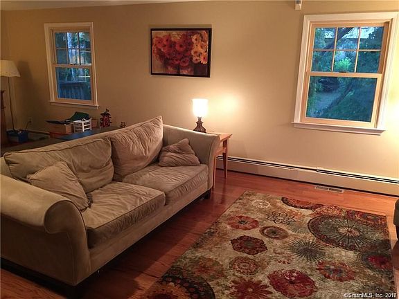 Living room with new hardwood floors and bay window