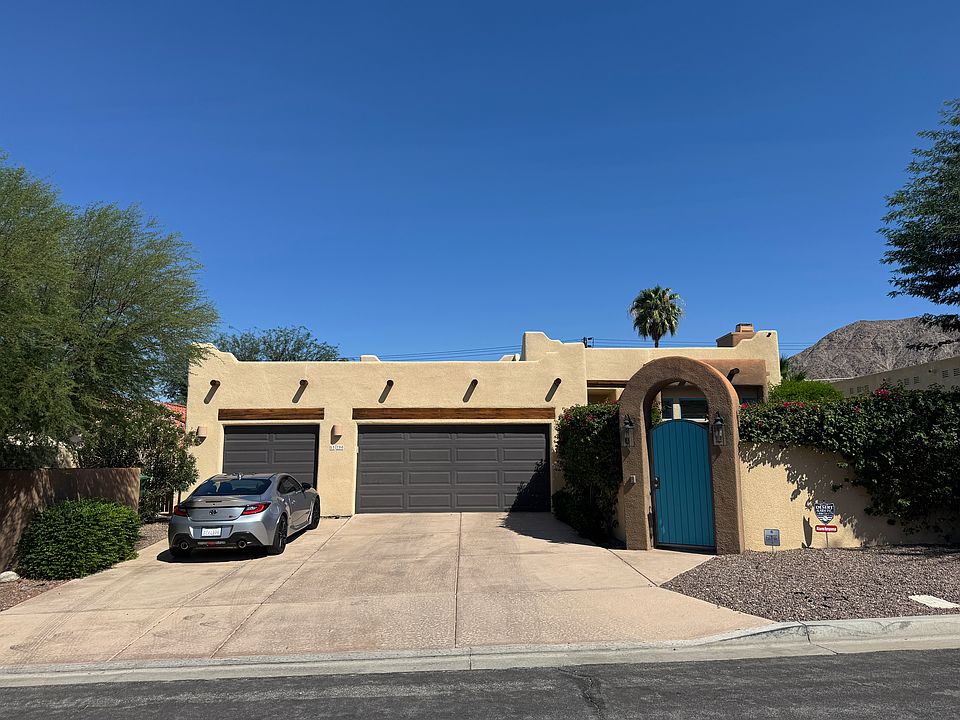Full 3 car garage and high wall completely fence oversized lot.