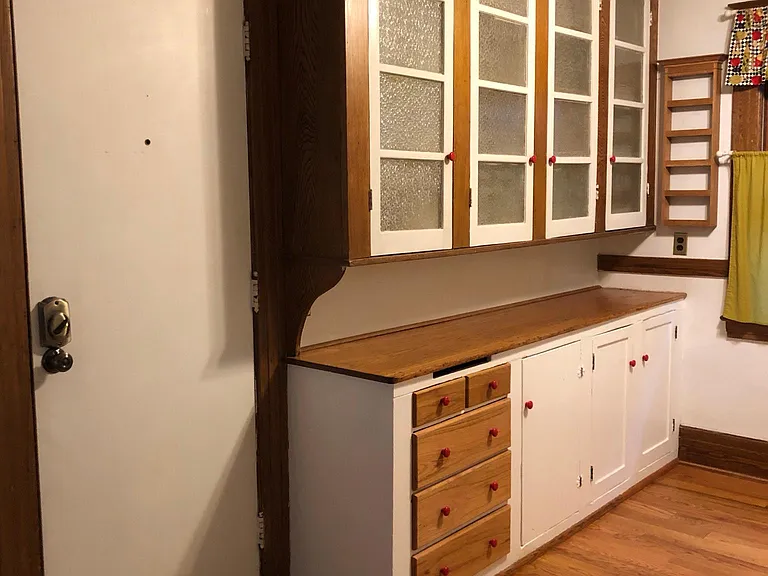 Kitchen frosted glass cupboards and upper back entrance.