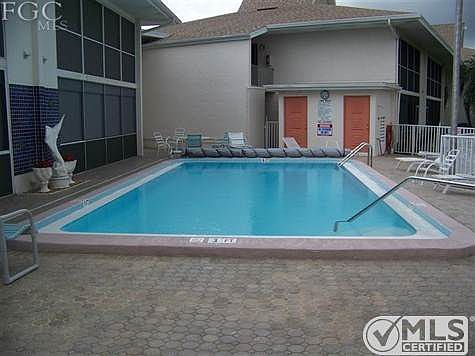 Great heated pool with brick pavers, bath room facility and lots of chairs/recliners.