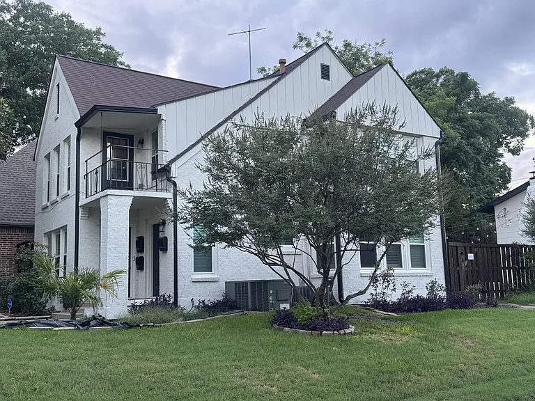 Side view of the duplex home from Alderson Avenue.