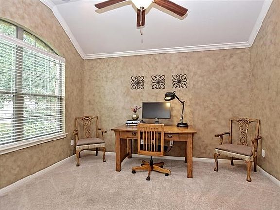Office w/ crown molding & french doors.
