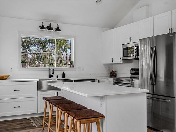 Place the dining table up against the island to seat up to 9 dinner guests