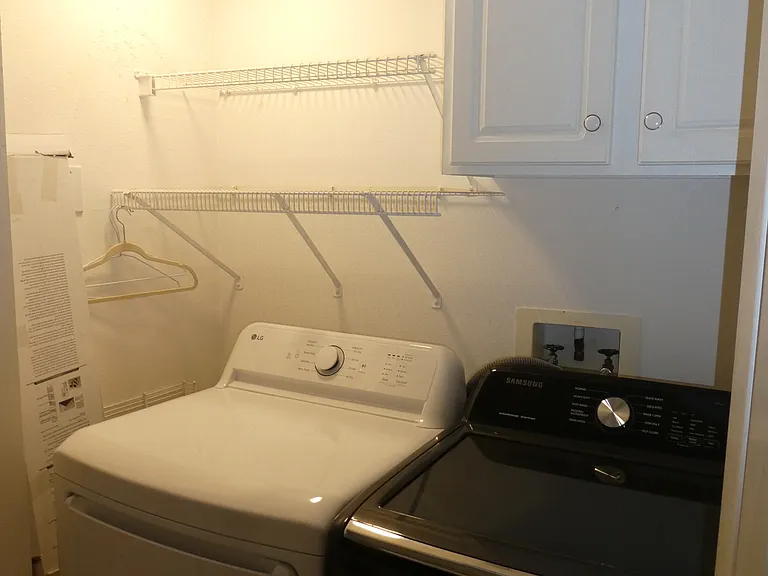 Indoor laundry w/ full size washer/dryer