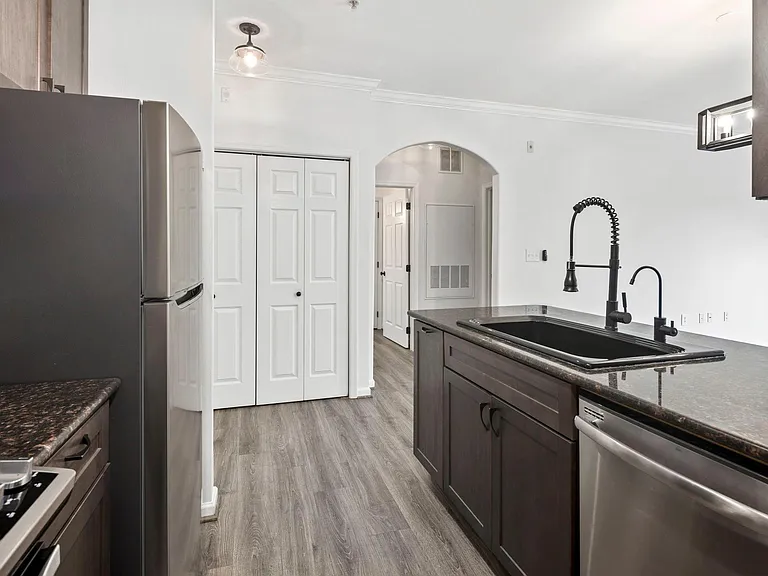 Kitchen with new refrigerator and new reverse osmosis water filtration system with dedicated faucet on the right.