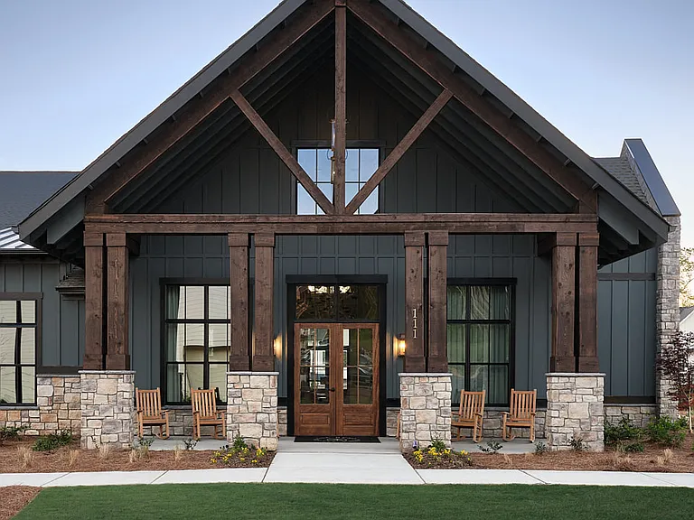 Clubhouse exterior with ample parking for future residents and visitors.