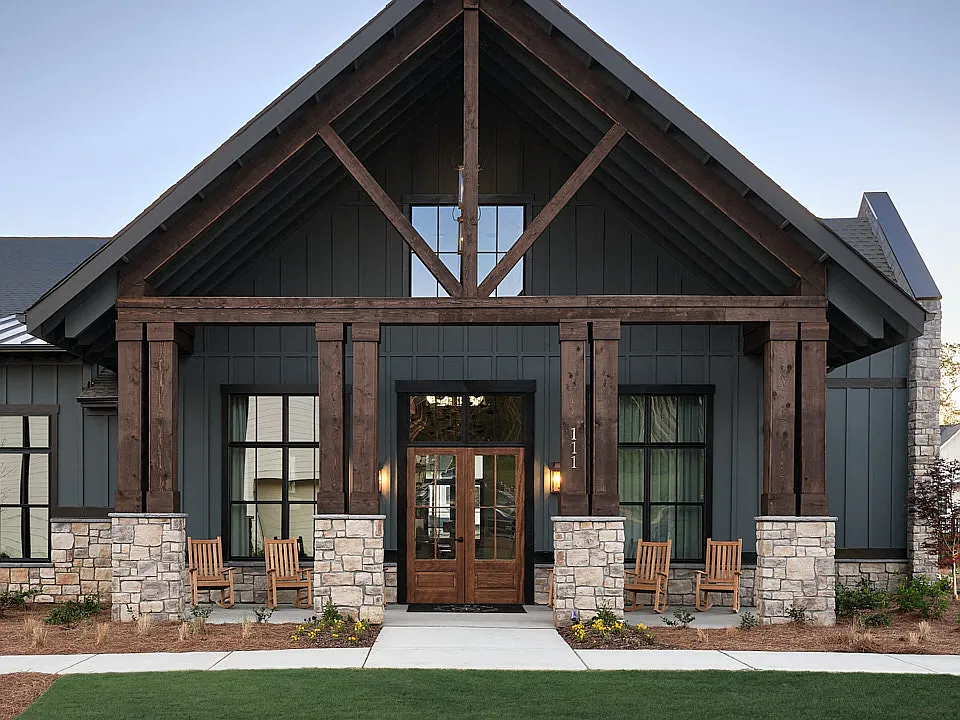Clubhouse exterior with ample parking for future residents and visitors.