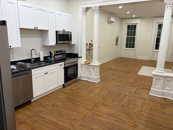 Sizable kitchen with excellent lighting with plenty of space for entertaining.