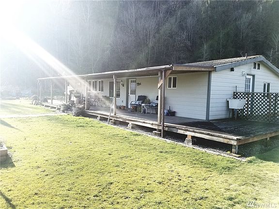 Home has a nice long covered porch to sit and just relax and enjoy your privacy and natures surroundings.