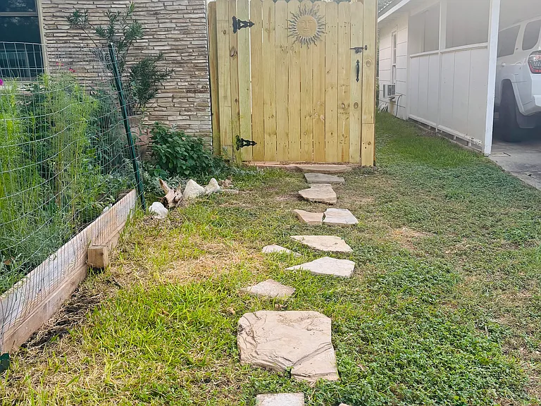 Private gated entrance with fenced yard. Secure and pet friendly.
