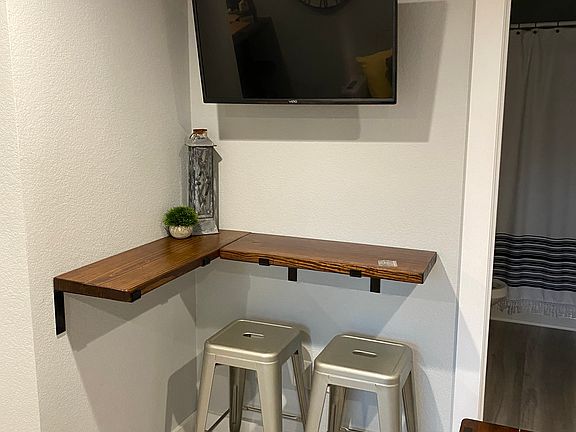 view of bar top/seating from living room sofa