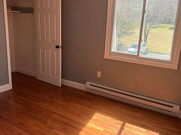 2nd bedrom with closet and view to front yard