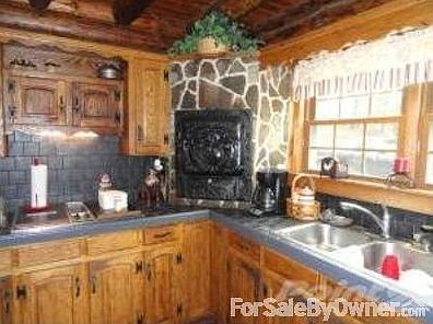New counter and beautiful cast iron oven
						:
						The kitchen has an eat in area and island seating. Lots of oak cabinetry.